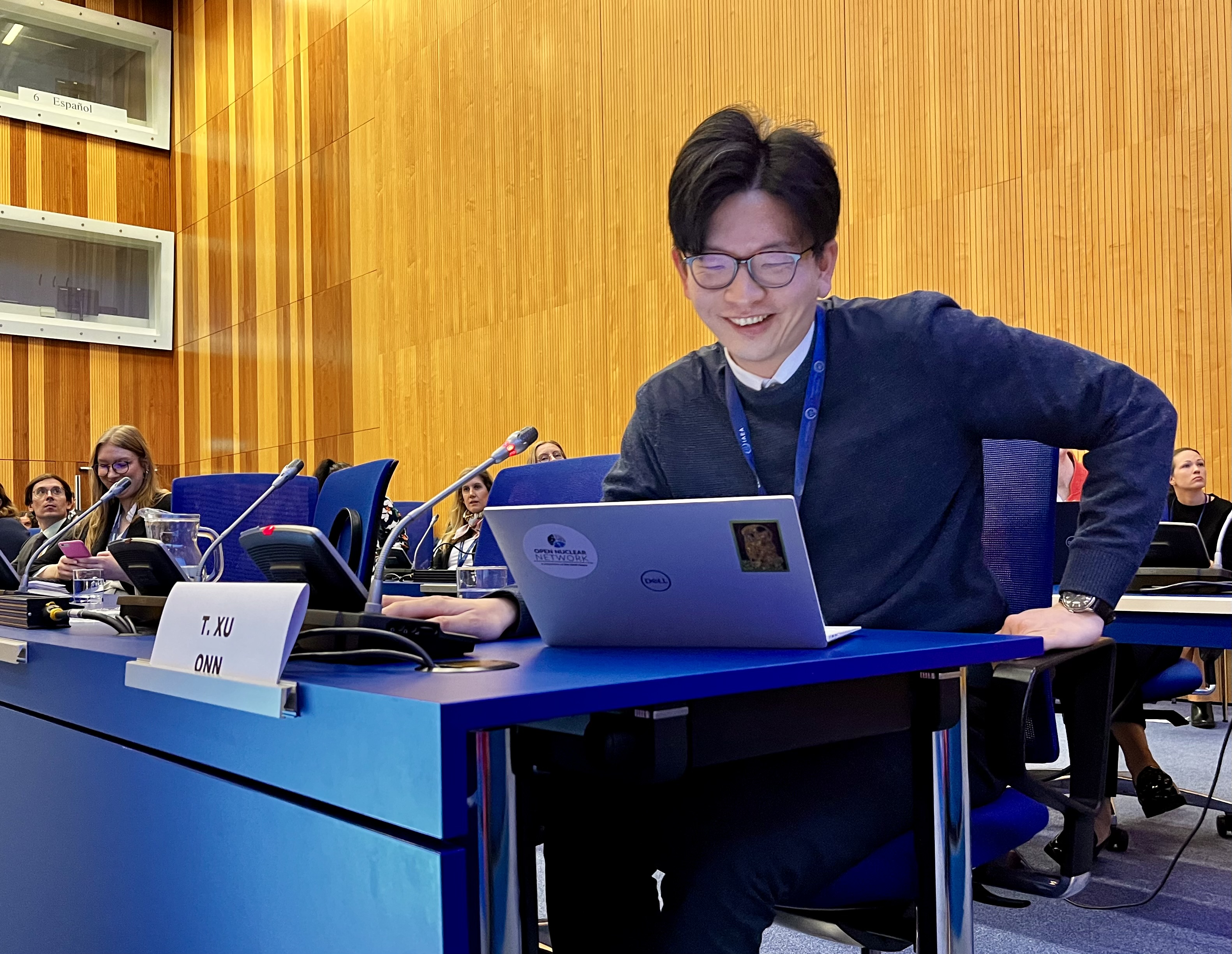 Tianran Xu delivers a presentation at the IAEA Symposium on International Safeguards.