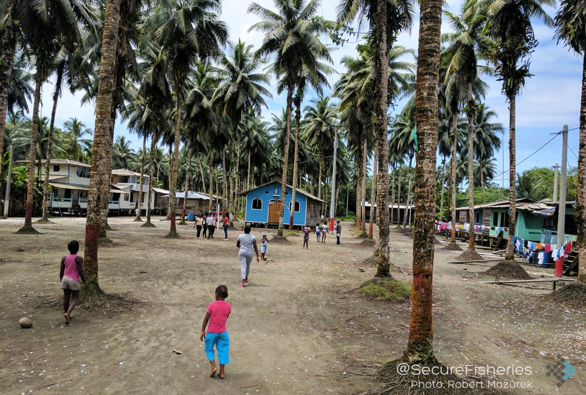 Children gather in Punta Bonita's village square. - Photo by Robert Mazurek