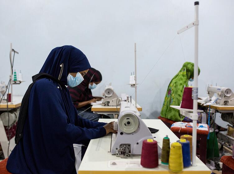 Woman sewing at Tayo