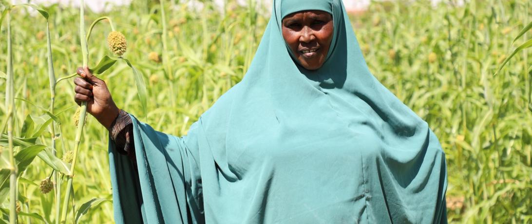 Somali Women standing in her farm