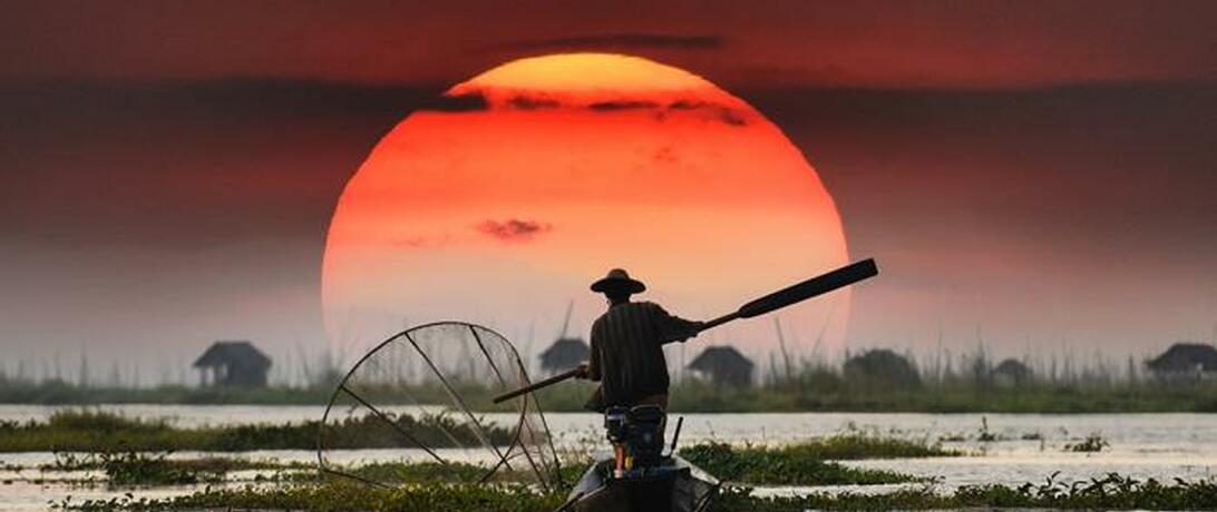 Man fishing in the sunset