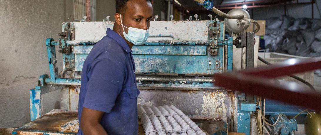 Man working at ADCO paper factory