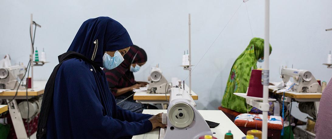 Woman sewing at Tayo