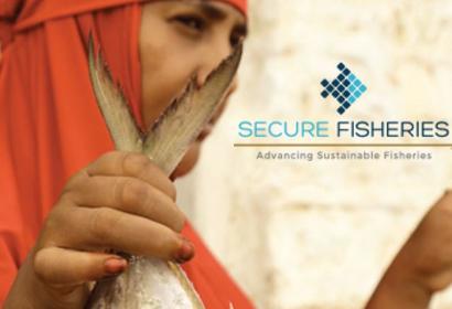 Somali woman holding a fish