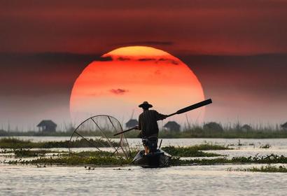 Man fishing in the sunset