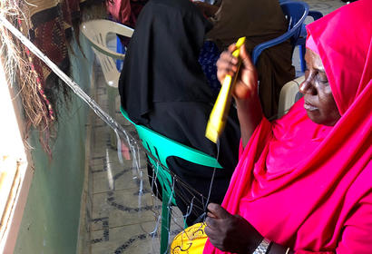 Somali women net mending making